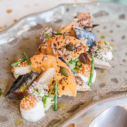 la vision de Òste restaurant la carte une cuisine de saison créative et engagée.